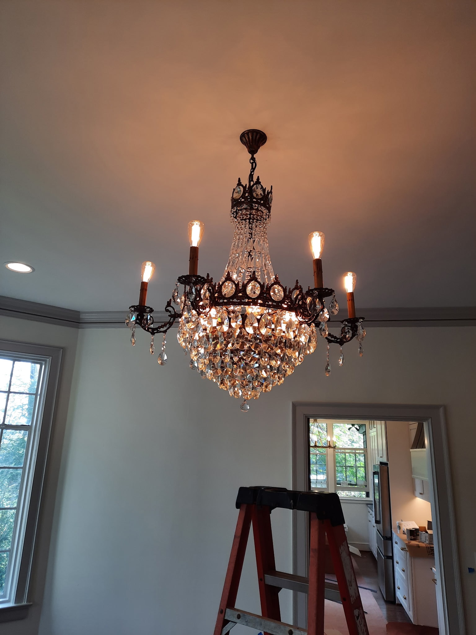 Illuminated crystal chandelier installation