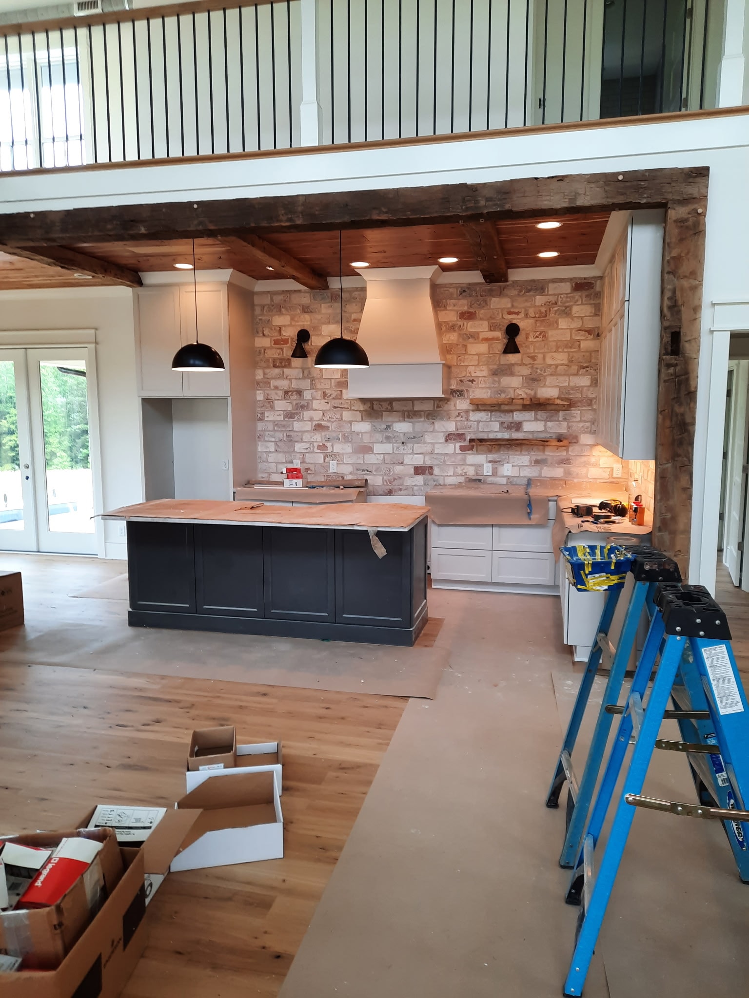 Kitchen renovation with recessed and pendant lighting installation